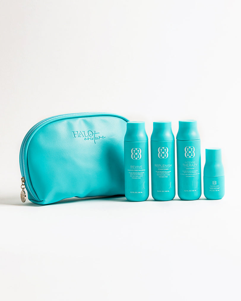 Travel kit with 4 bottles of hair care products: shampoo, conditioner, and hair serum. Perfect for on-the-go hair care.