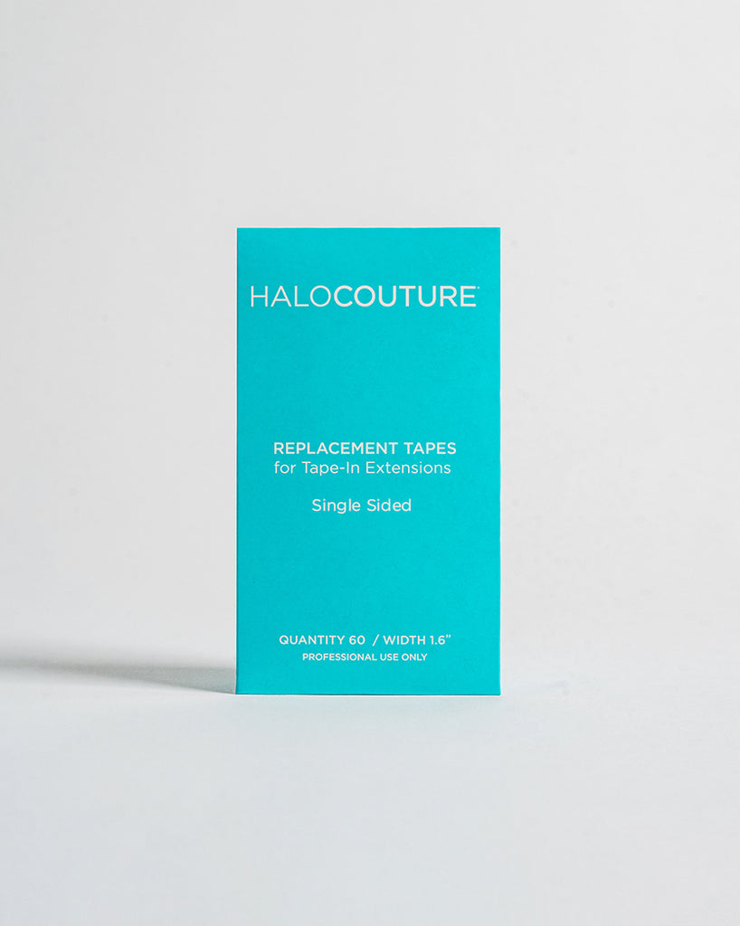 A bright teal color box standing upright of replacement tapes against a light grey background, And the white color text on it.