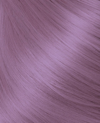 A close-up of a pink hair-color hair extension from Halo Couture.